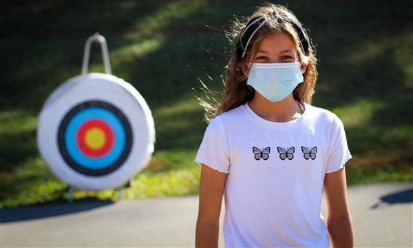 Girl stands in front of target